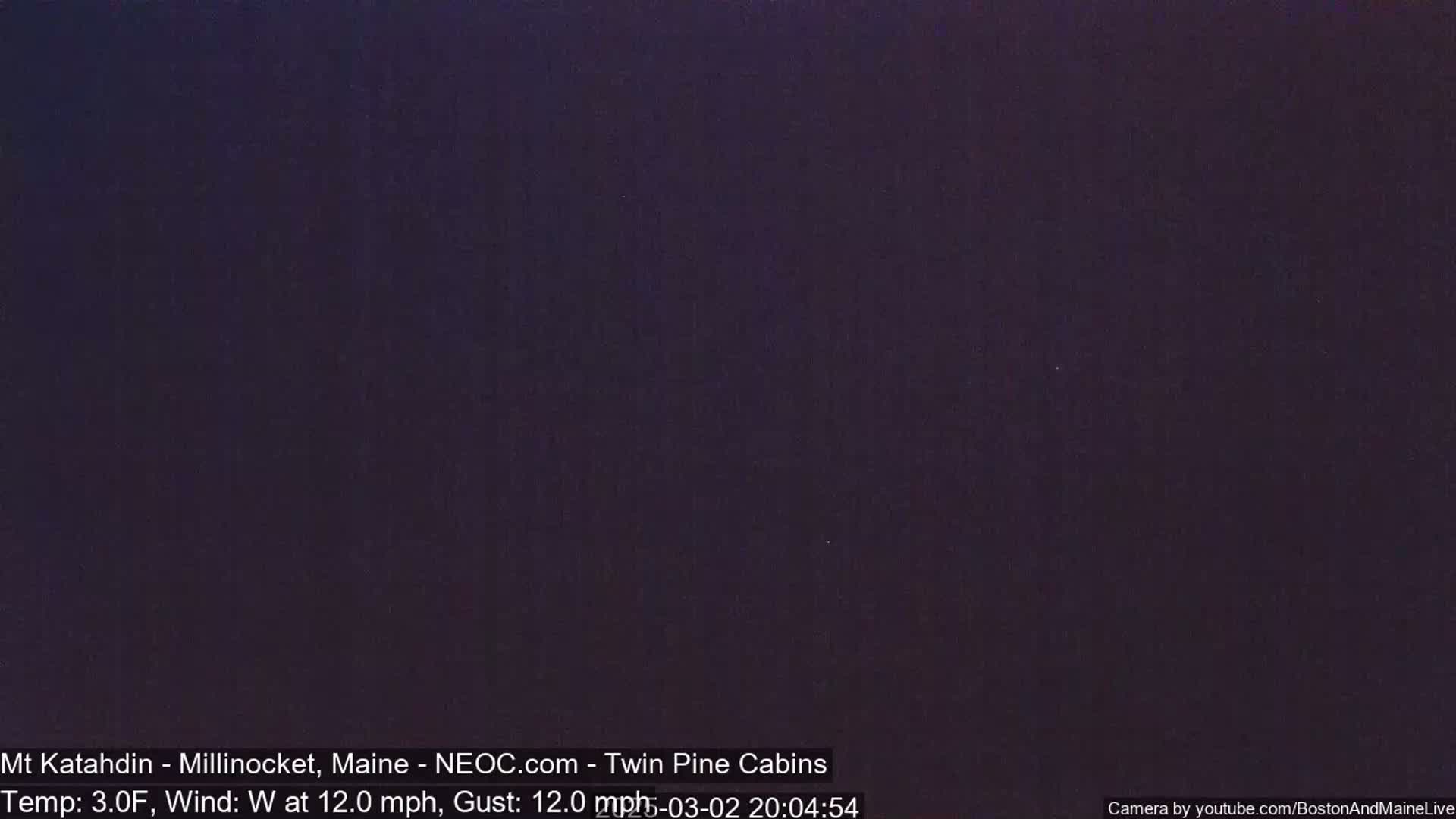 A dark, nighttime image shows an overcast sky with a temperature of 3 degrees Fahrenheit and a westerly wind of 12 mph.