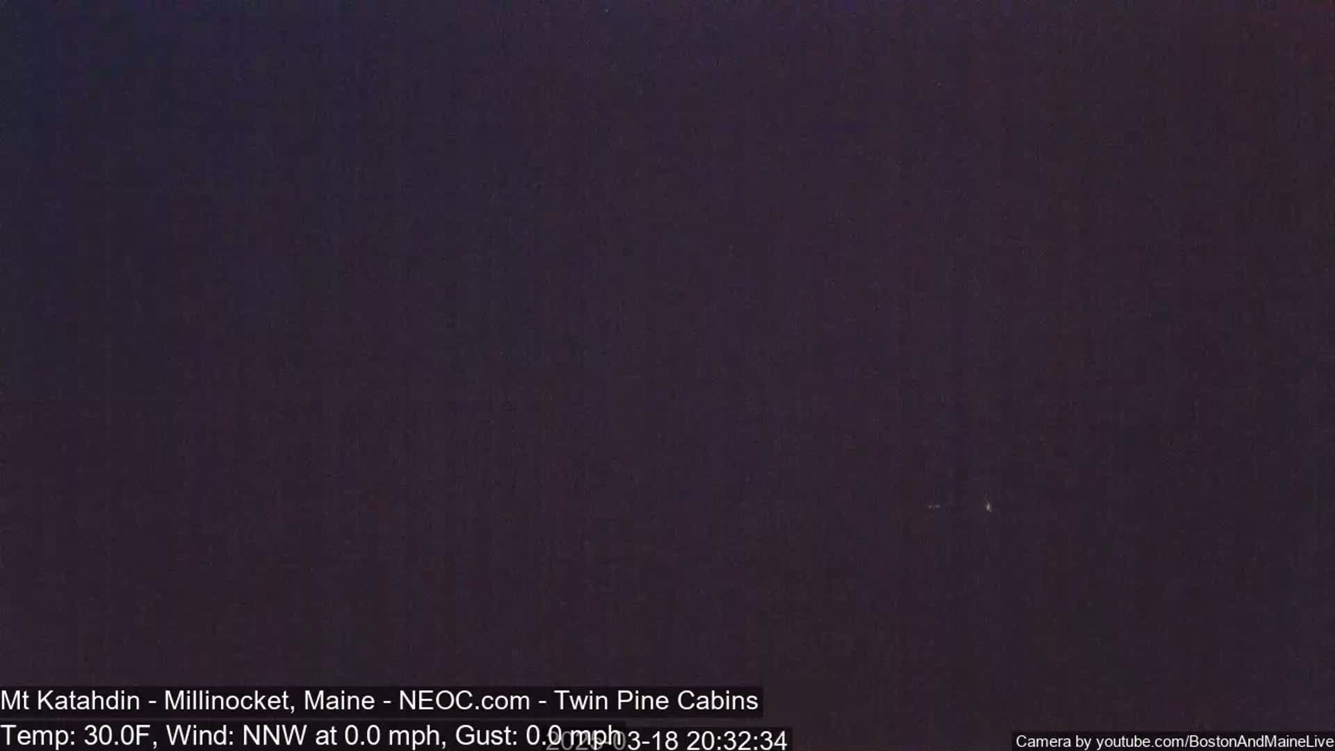 A dark, nighttime scene with a temperature of 30°F and a calm north-northwest wind.