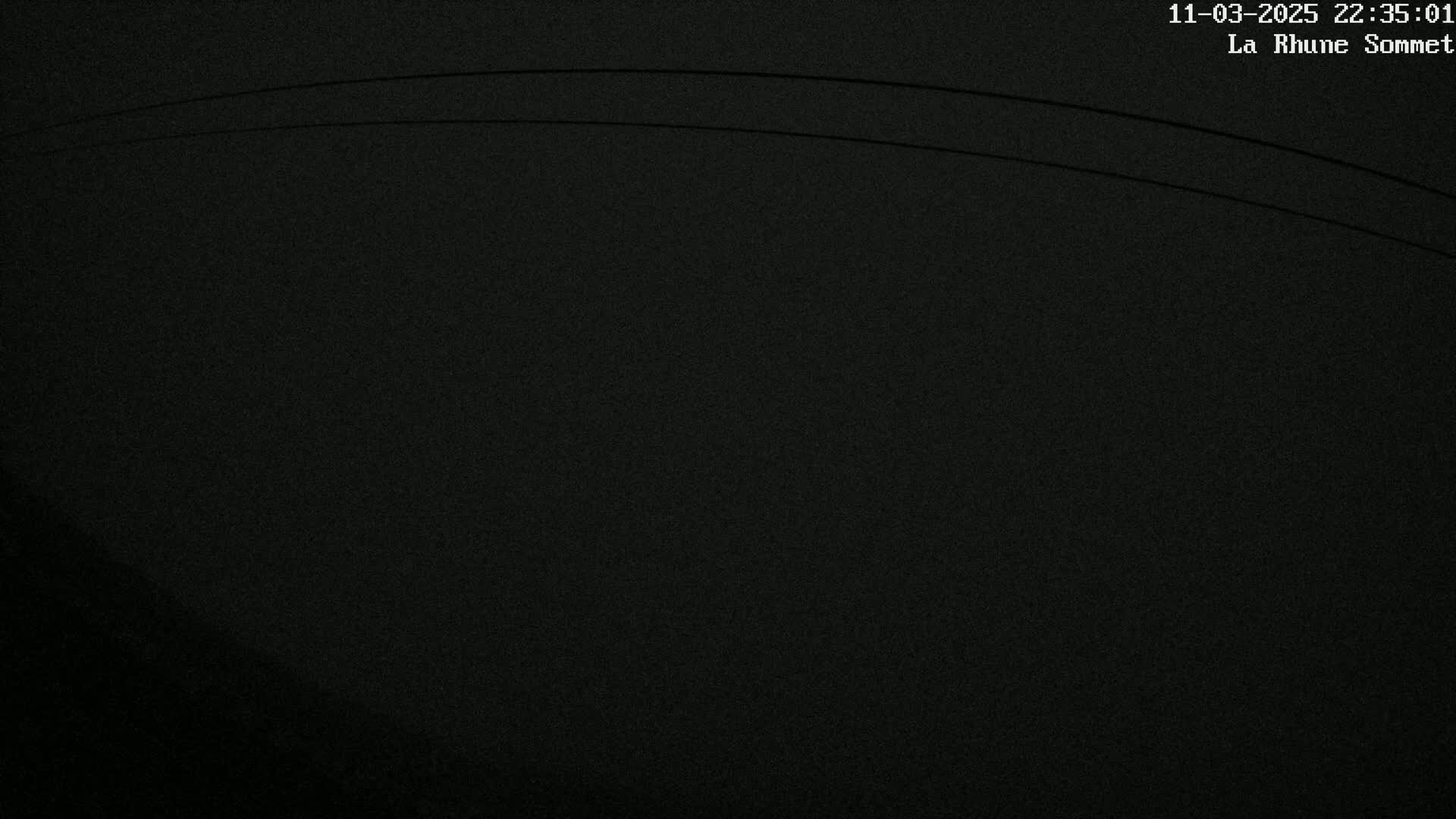 A mostly dark, grainy image shows two thin, slightly curved lines across the top.