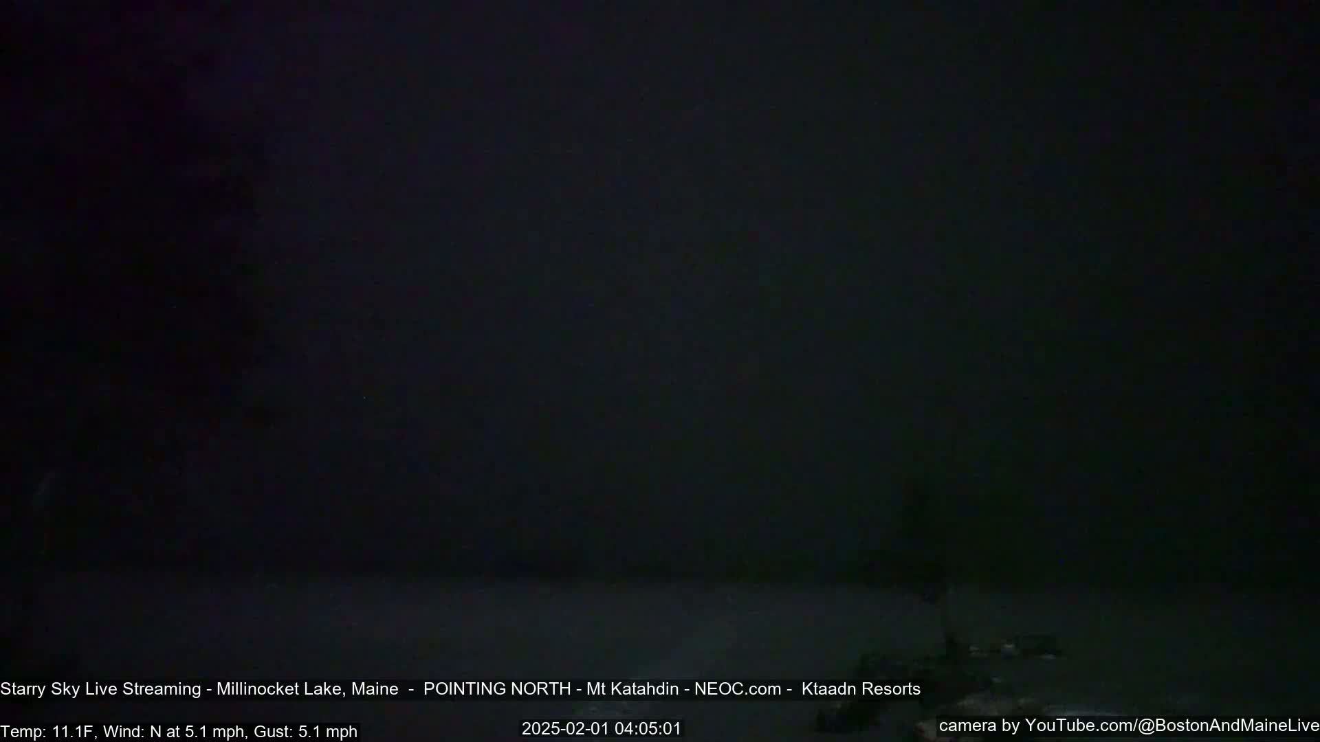 A dark, nighttime scene shows a mostly featureless black sky with a slight north wind.