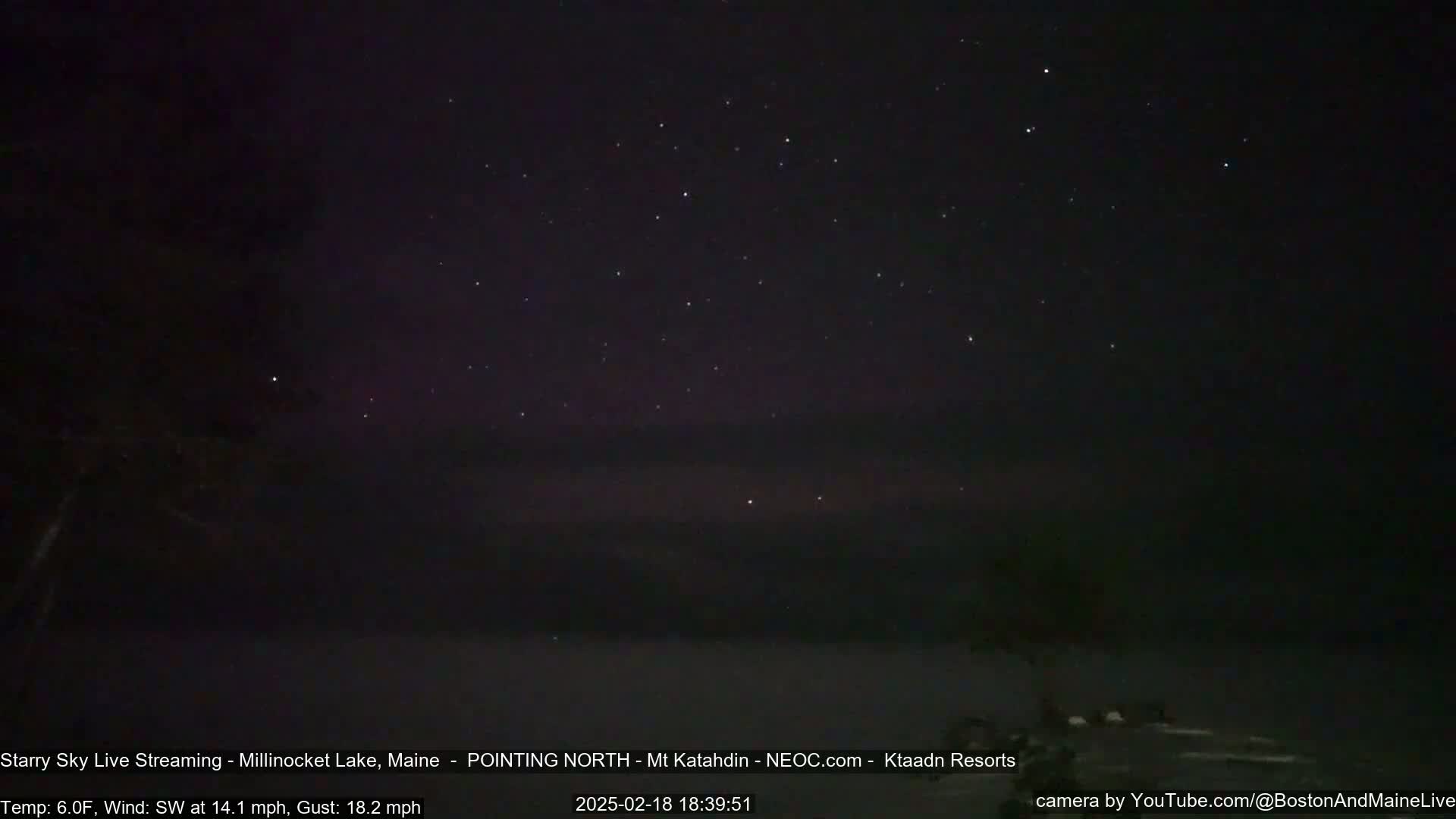 A nighttime view of a starry sky over a dark landscape under a southwest wind of 14.1 mph with gusts up to 18.2 mph and a temperature of 6°F.