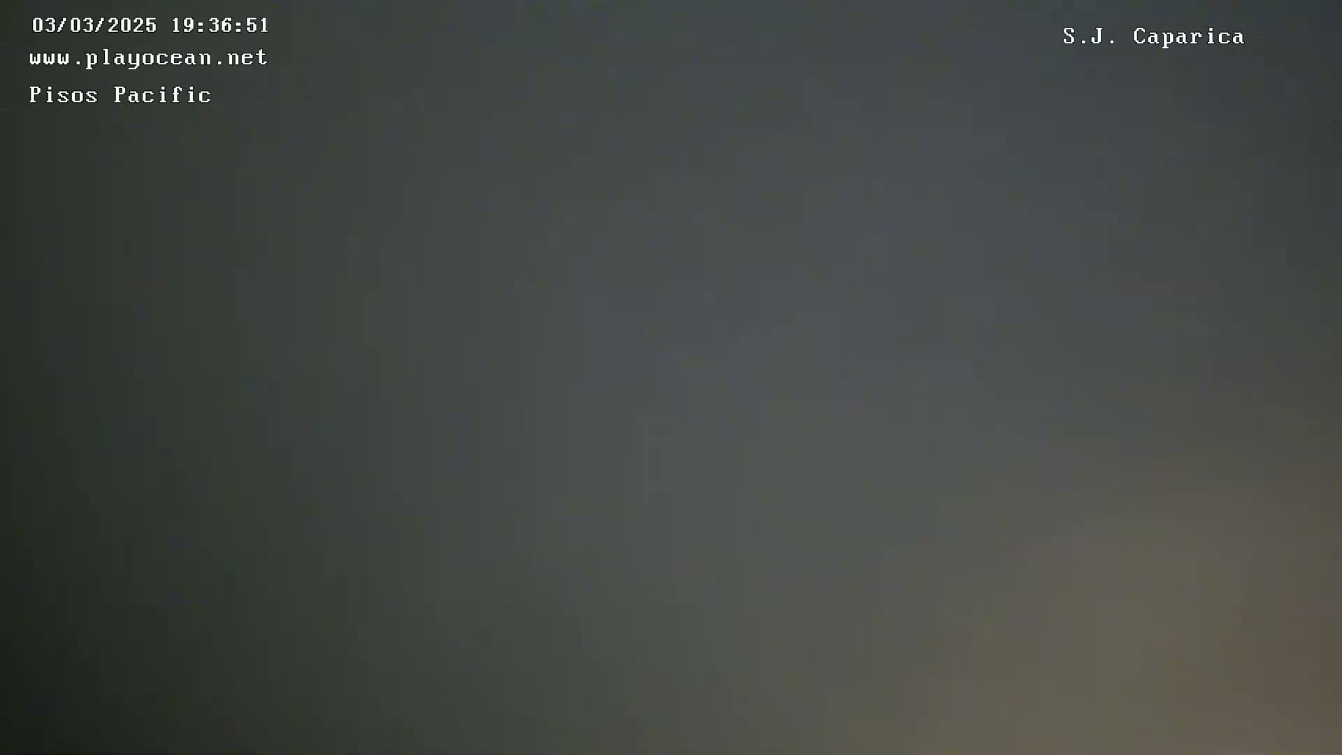 A mostly dark gray, overcast sky is visible.