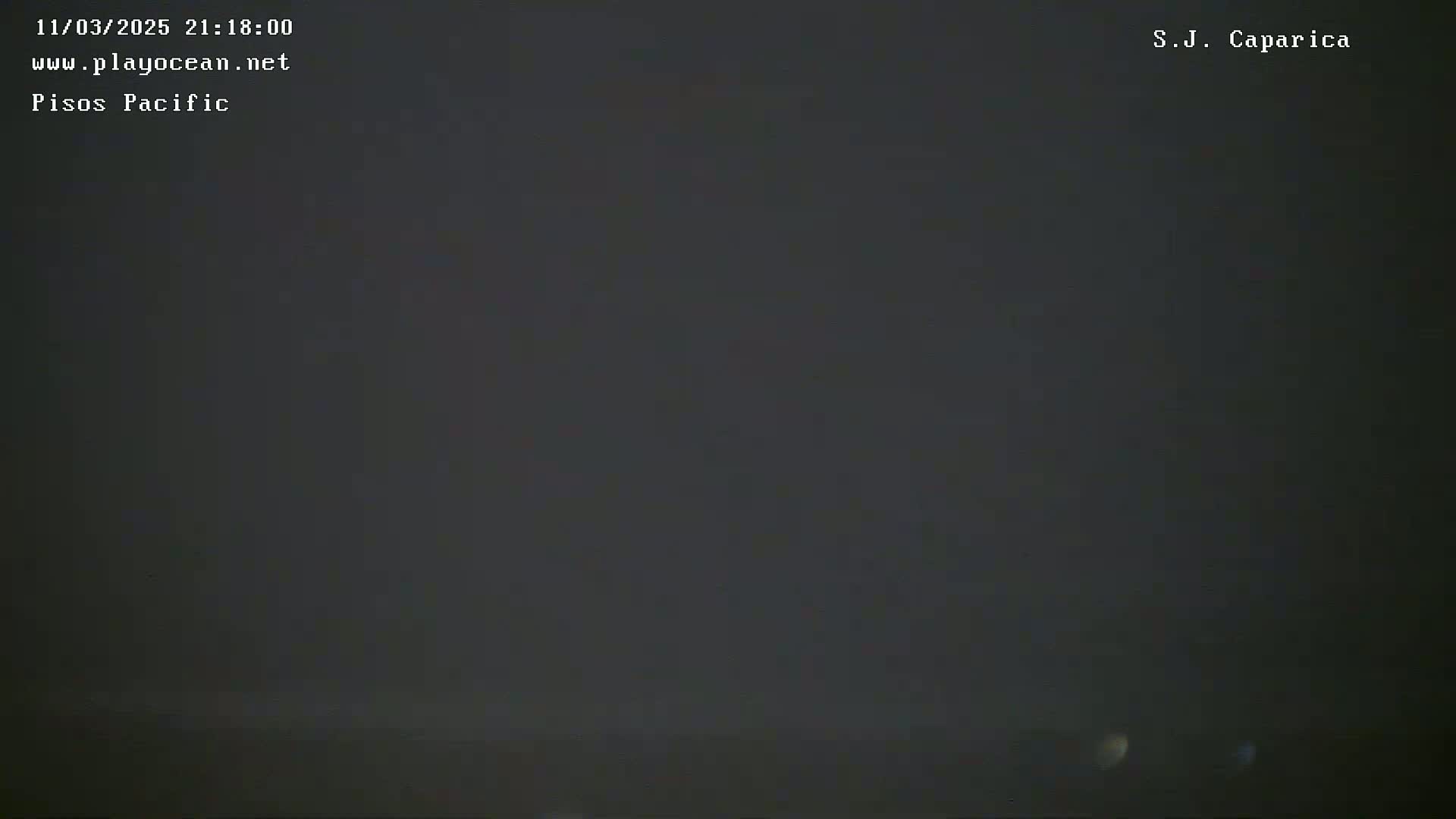 A dark, hazy, nighttime scene is shown.