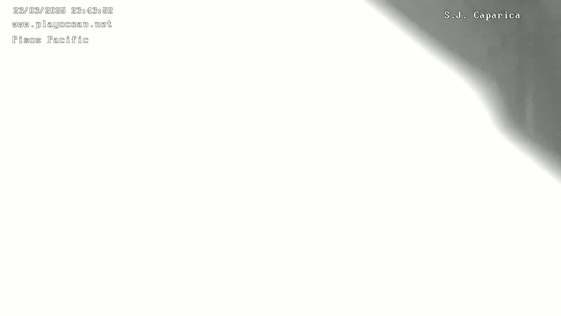 A mostly white image shows a dark gray shadow in the upper right corner.