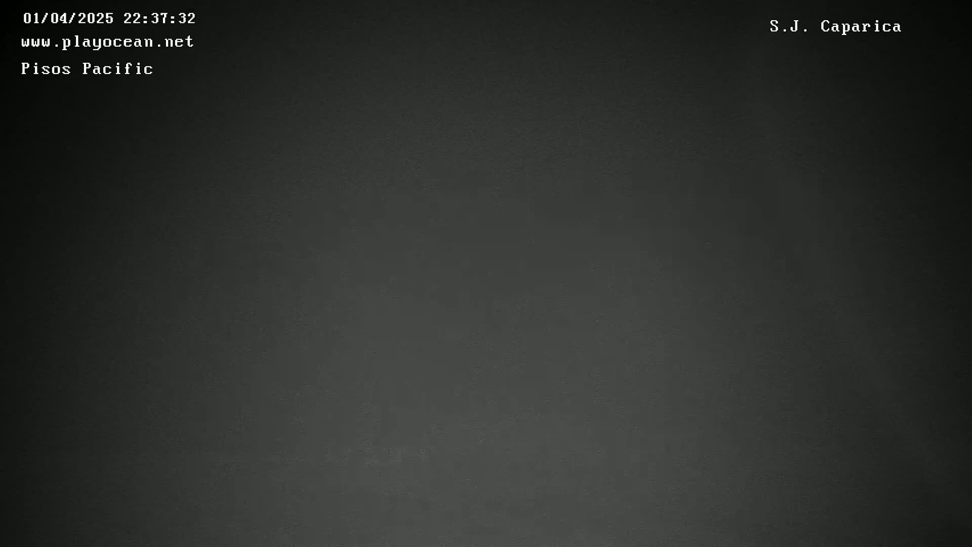 The image shows a dark gray textured surface.