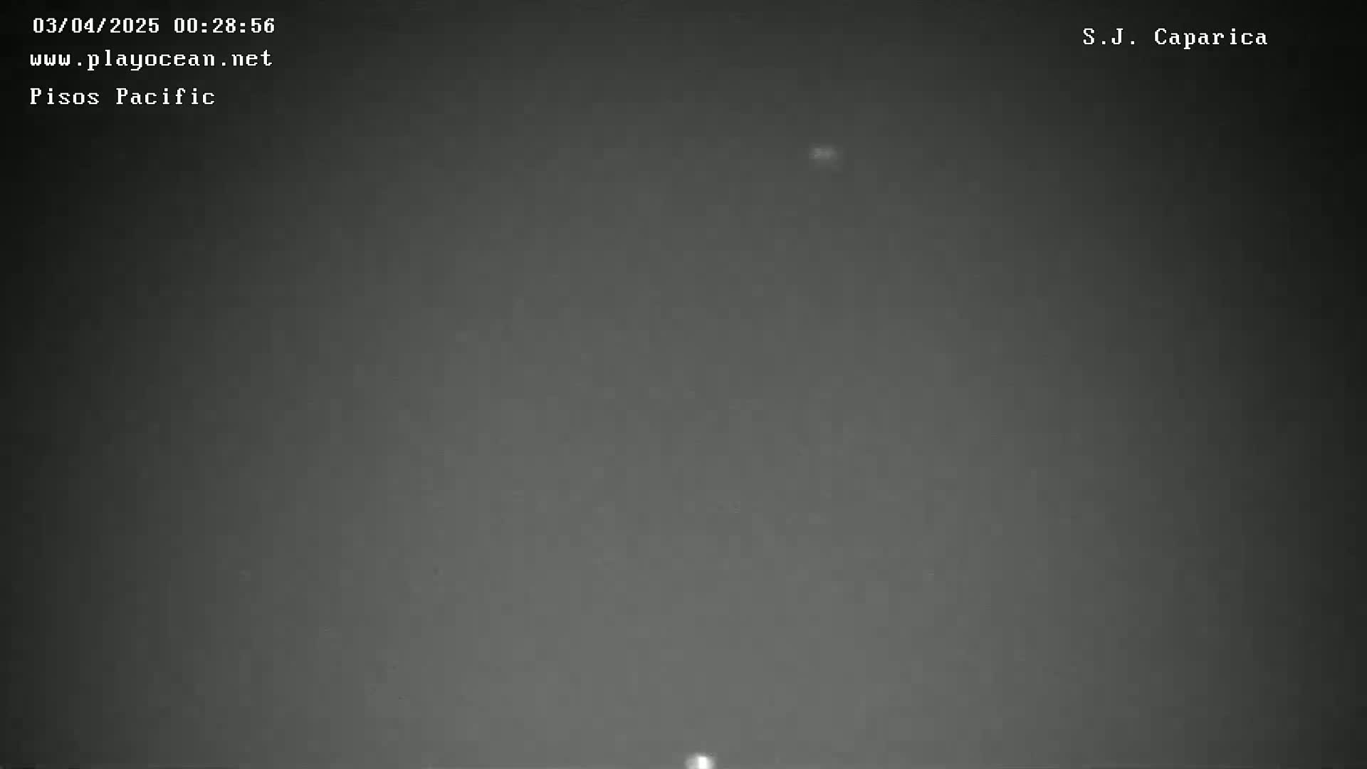 A nighttime, dark gray, overcast sky is shown.
