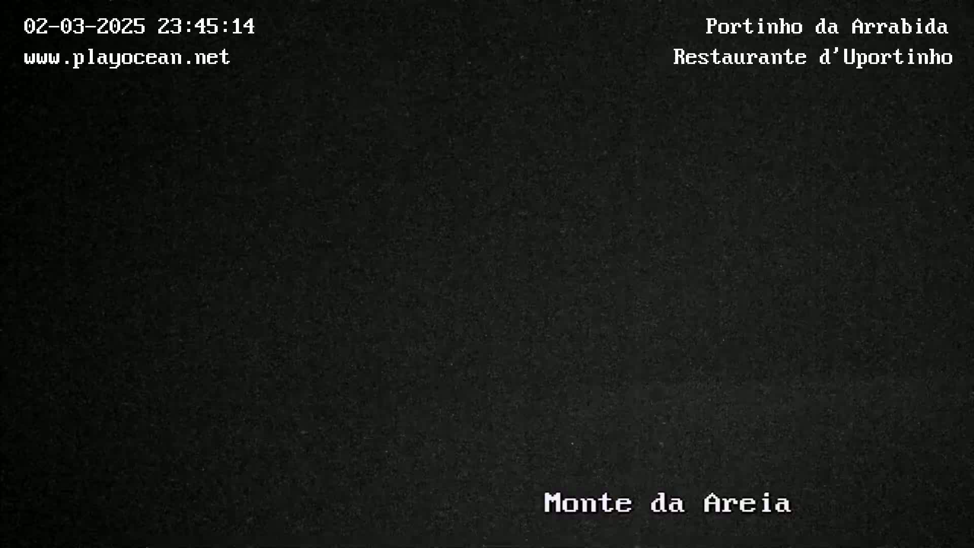 The image shows a completely dark, nighttime scene.