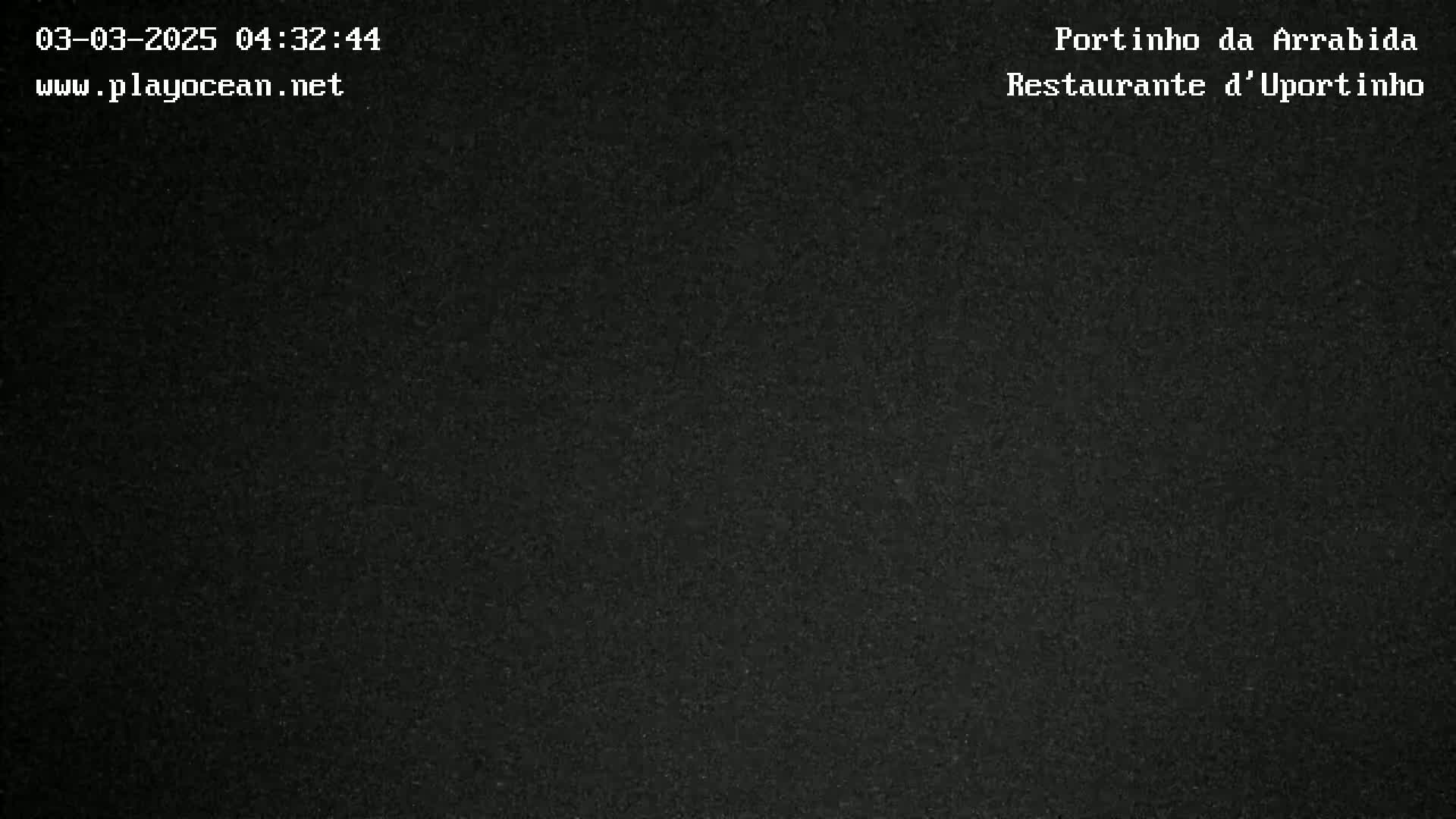The image shows a uniformly dark gray or black surface.