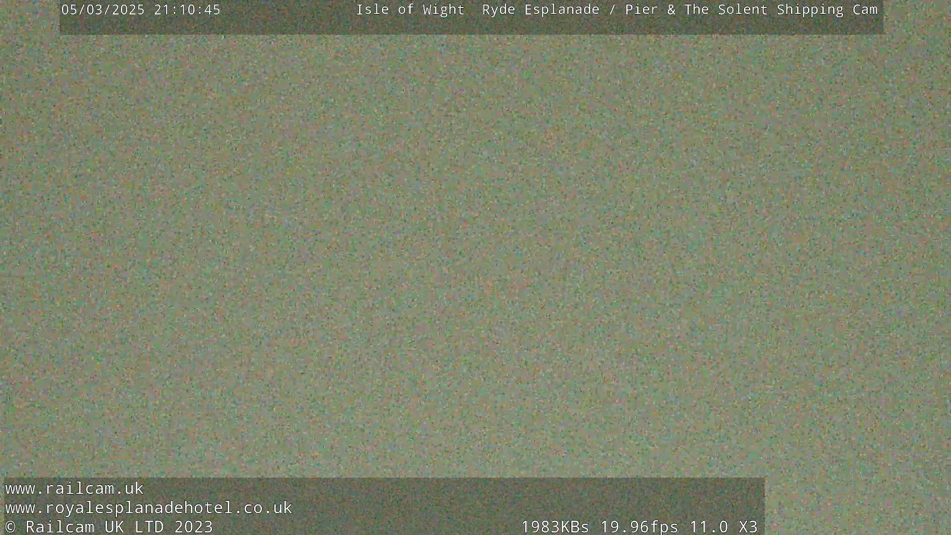 A grainy, muted green image shows a static view with no discernible features.