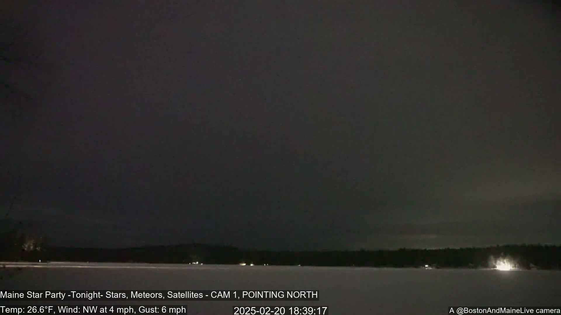 A nighttime, snow-covered landscape is visible under a dark sky with a northwest wind at 4 mph and gusts up to 6 mph.