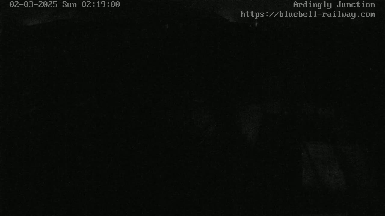 The image is completely dark, appearing to show a nighttime outdoor scene with very poor visibility.