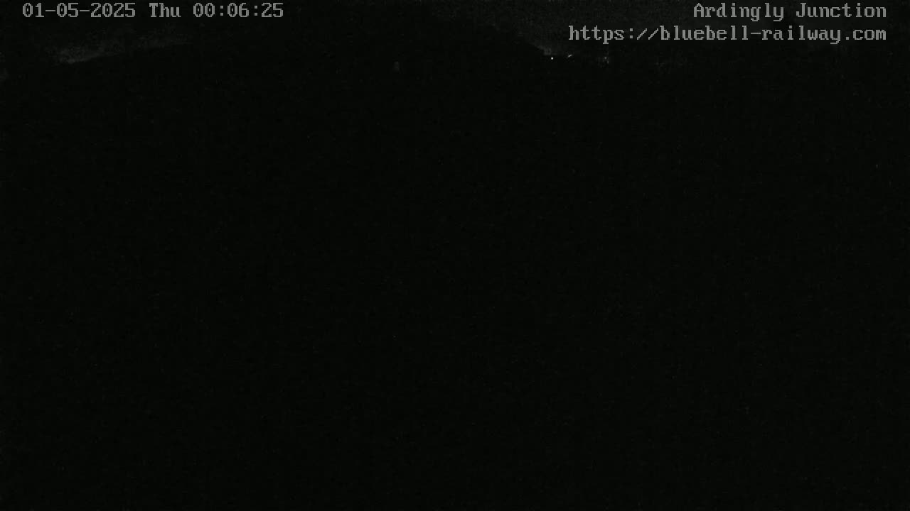 The image shows a completely black, dark scene.