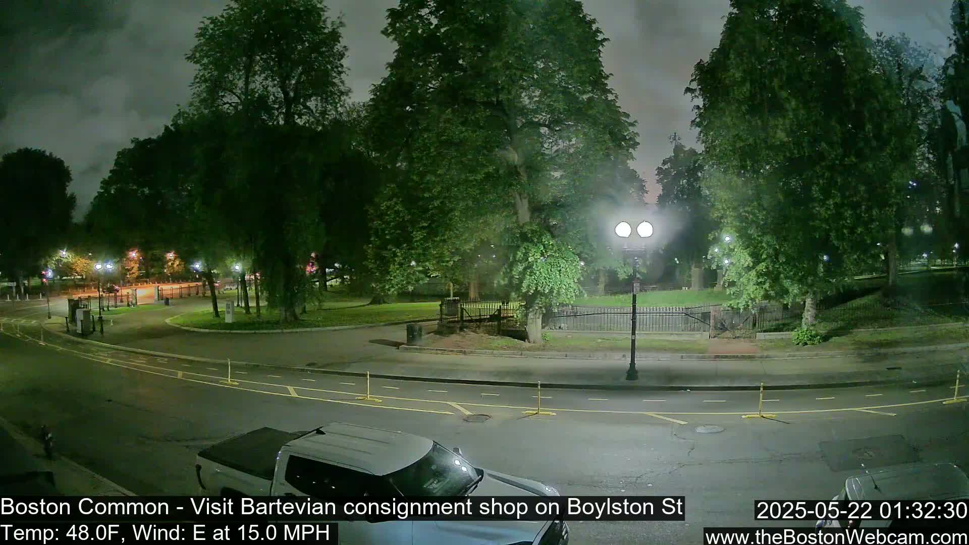 A nighttime view of a park and street, with overcast skies and a 15 mph easterly wind.