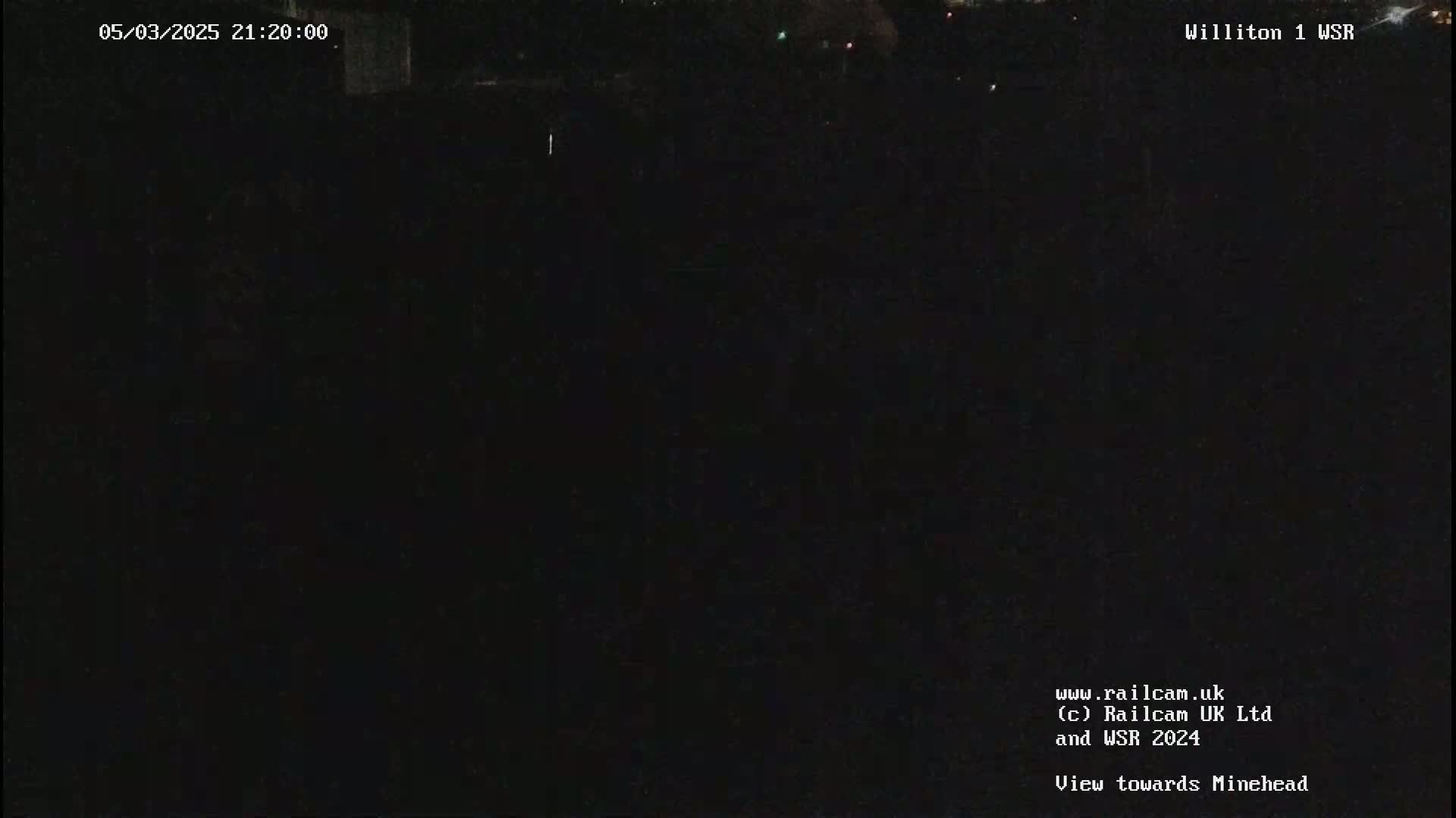 A nighttime, dark view of an empty field.