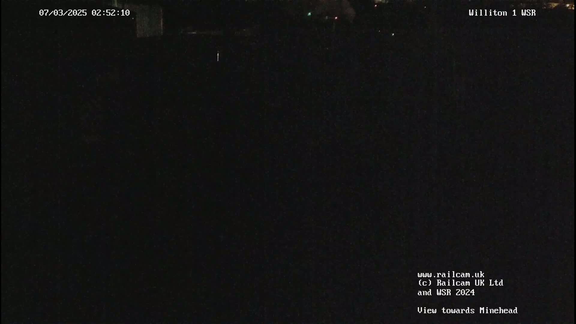 A dark, nighttime view of an empty landscape.