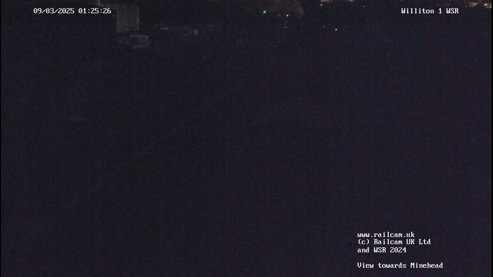 A nighttime, dark view towards Minehead.