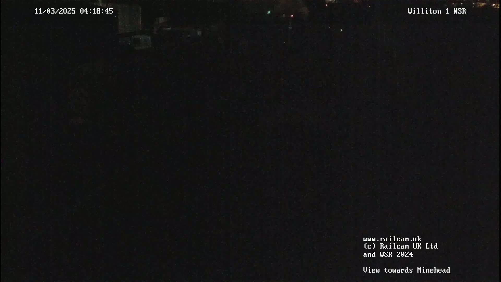 A nighttime, dark view of an empty field.