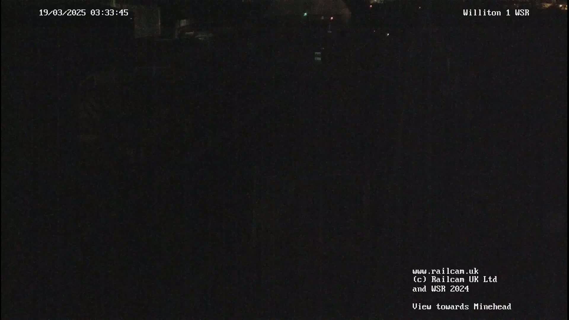 A dark, nighttime view of an empty landscape.
