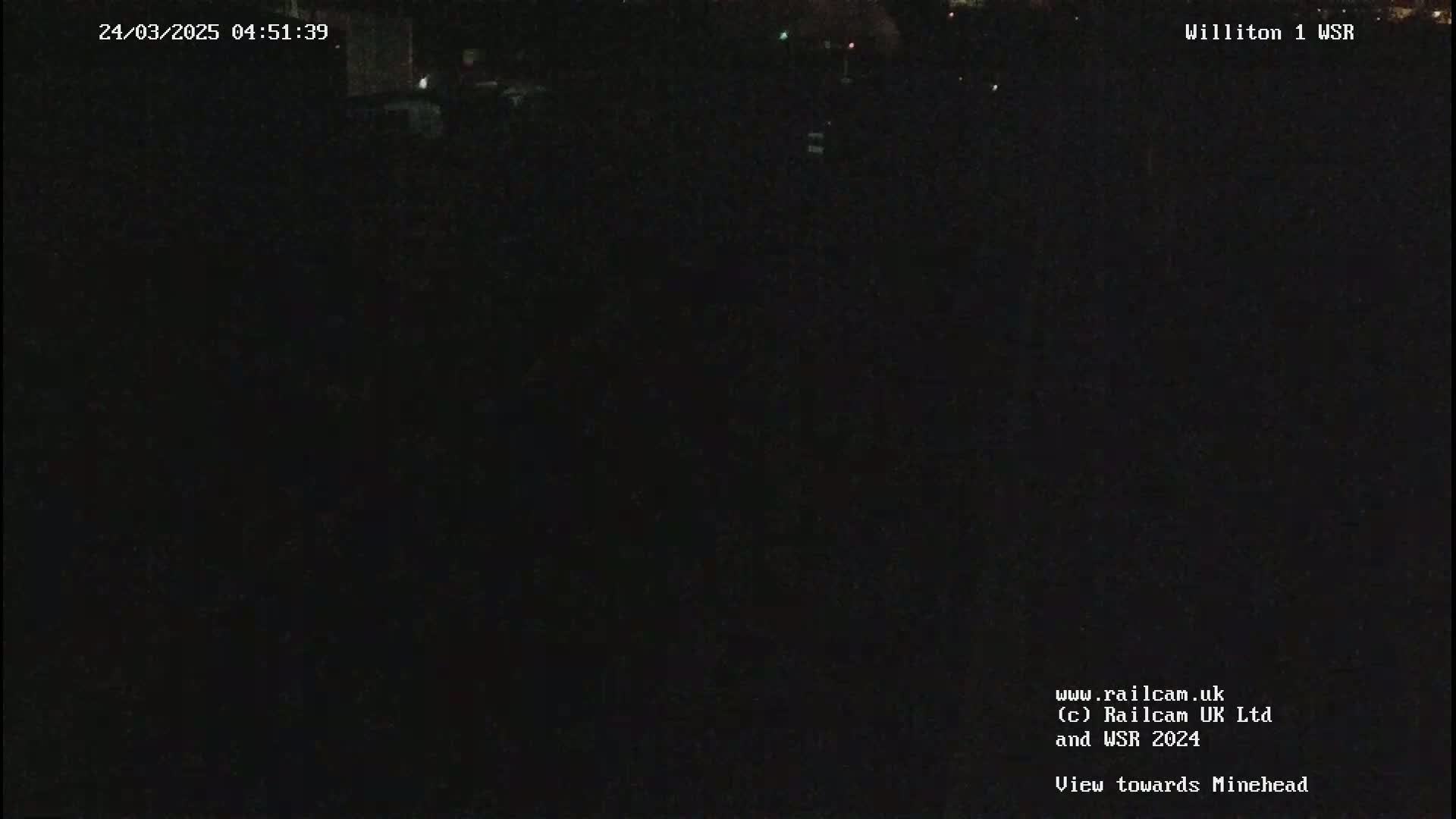 A dark, nighttime view of a landscape.