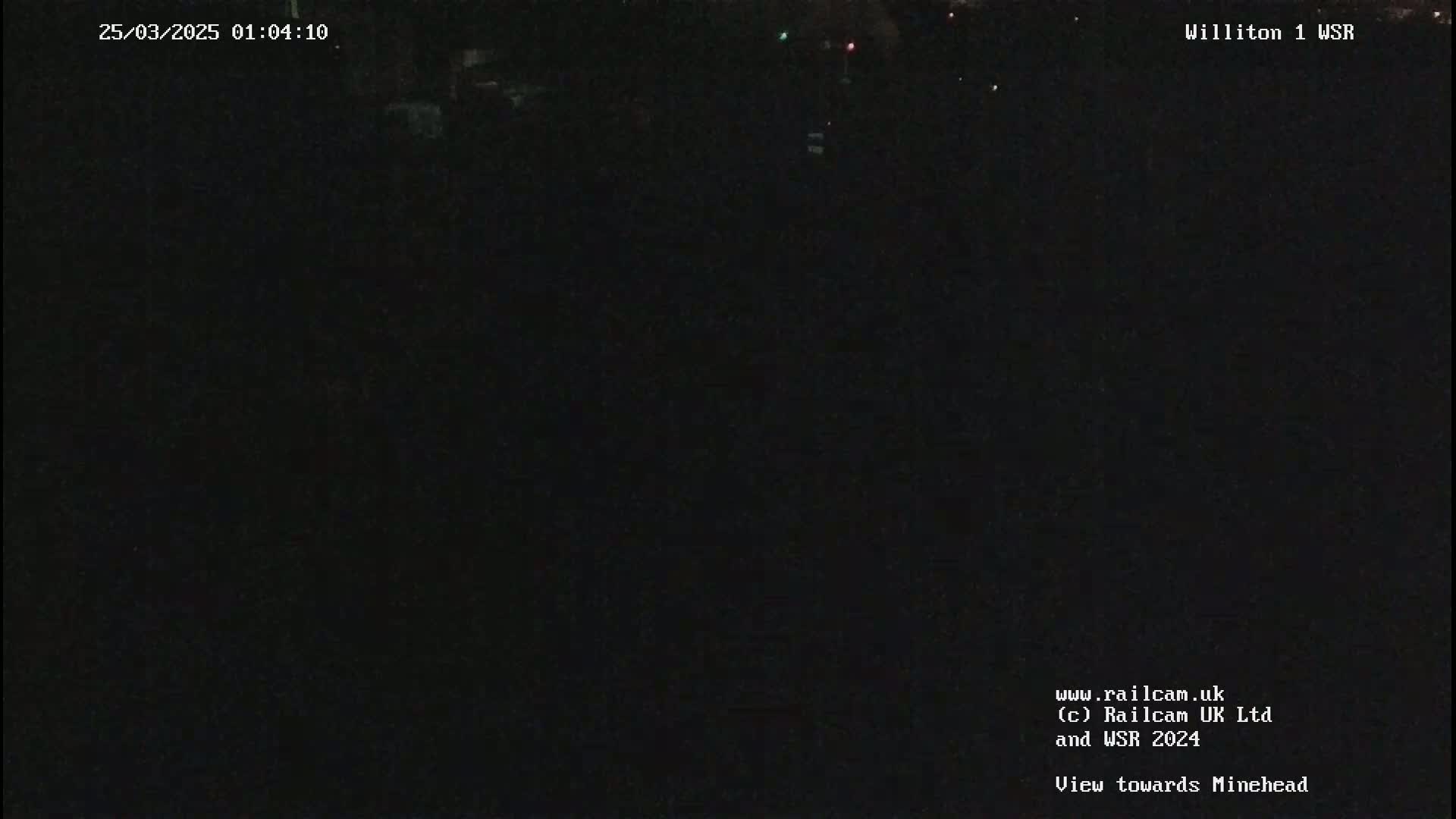 A dark, nighttime scene is visible, possibly outdoors.
