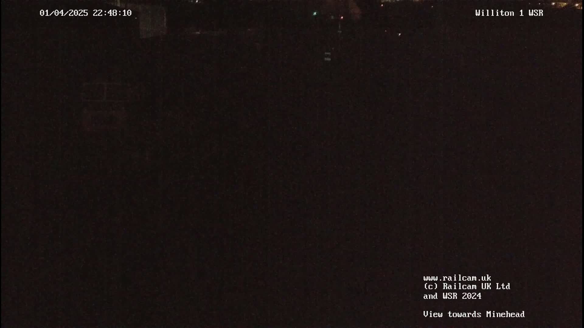 A dark, nighttime view of an empty landscape.