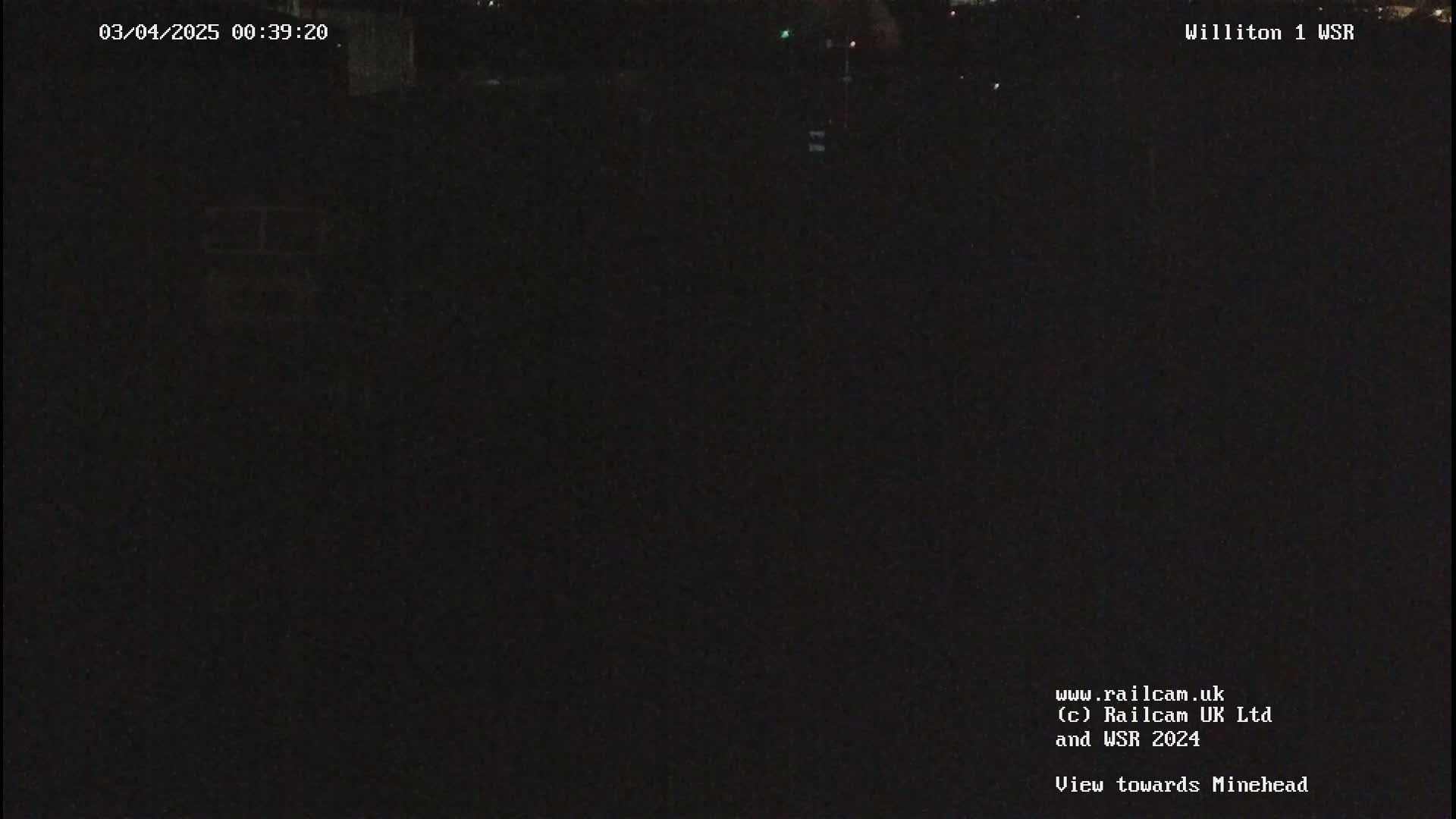 A very dark, nighttime view of an empty area.