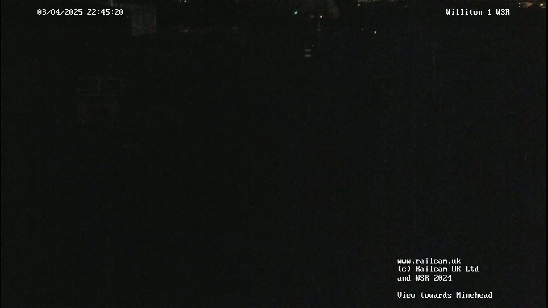 A dark nighttime scene is visible, showing an outdoor view with minimal light.