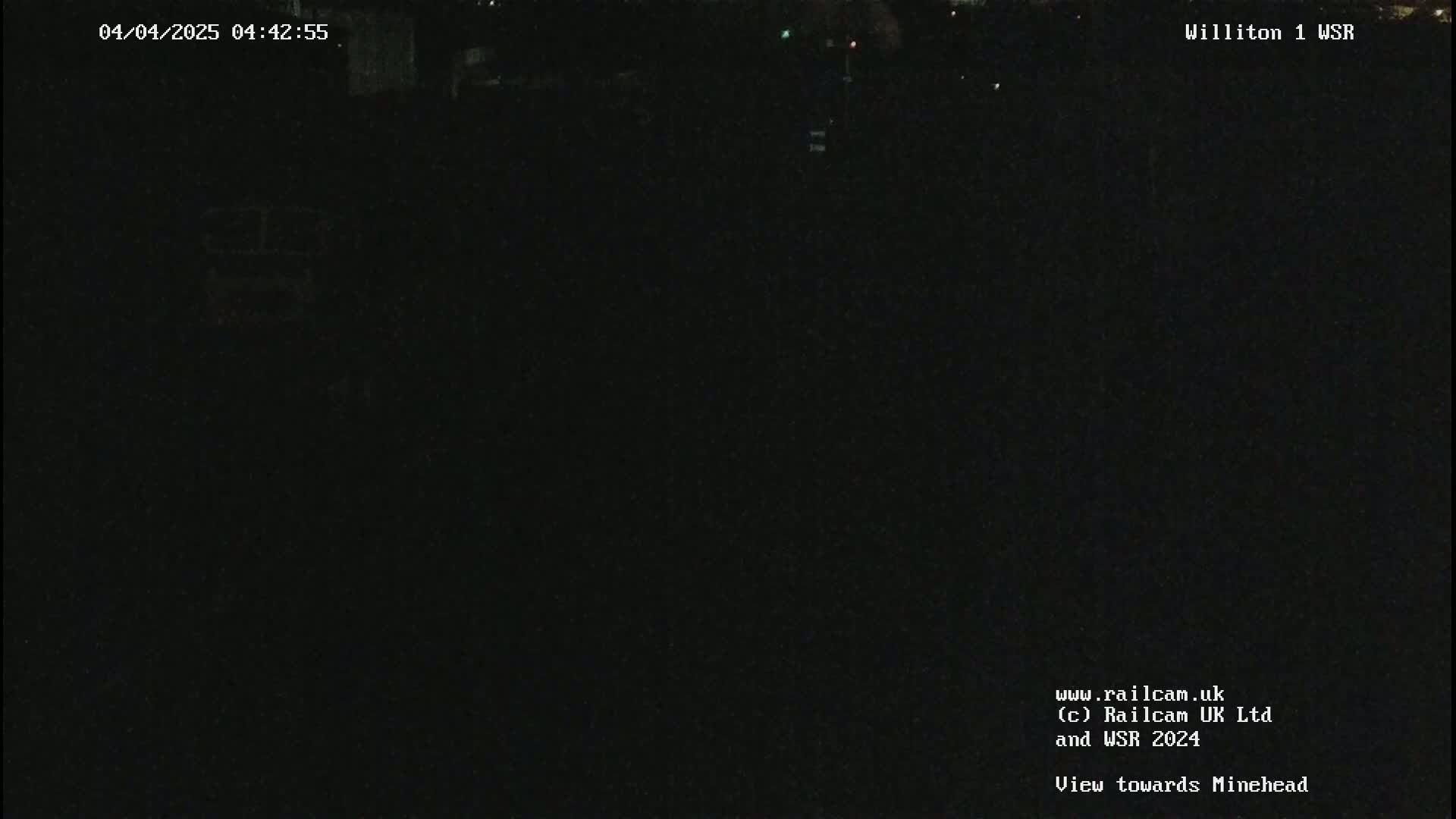 A dark, nighttime view of an empty area.