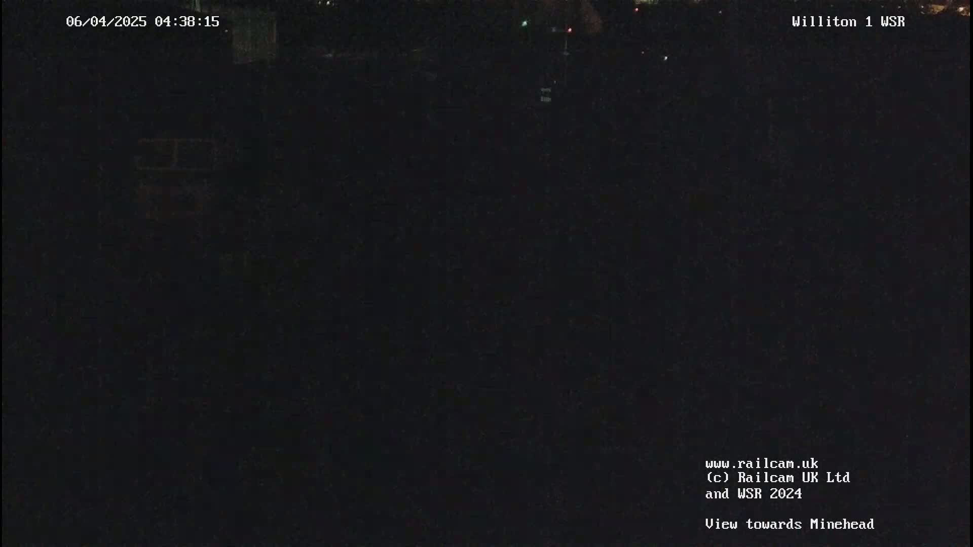 A dark, nighttime scene is visible, possibly outdoors.