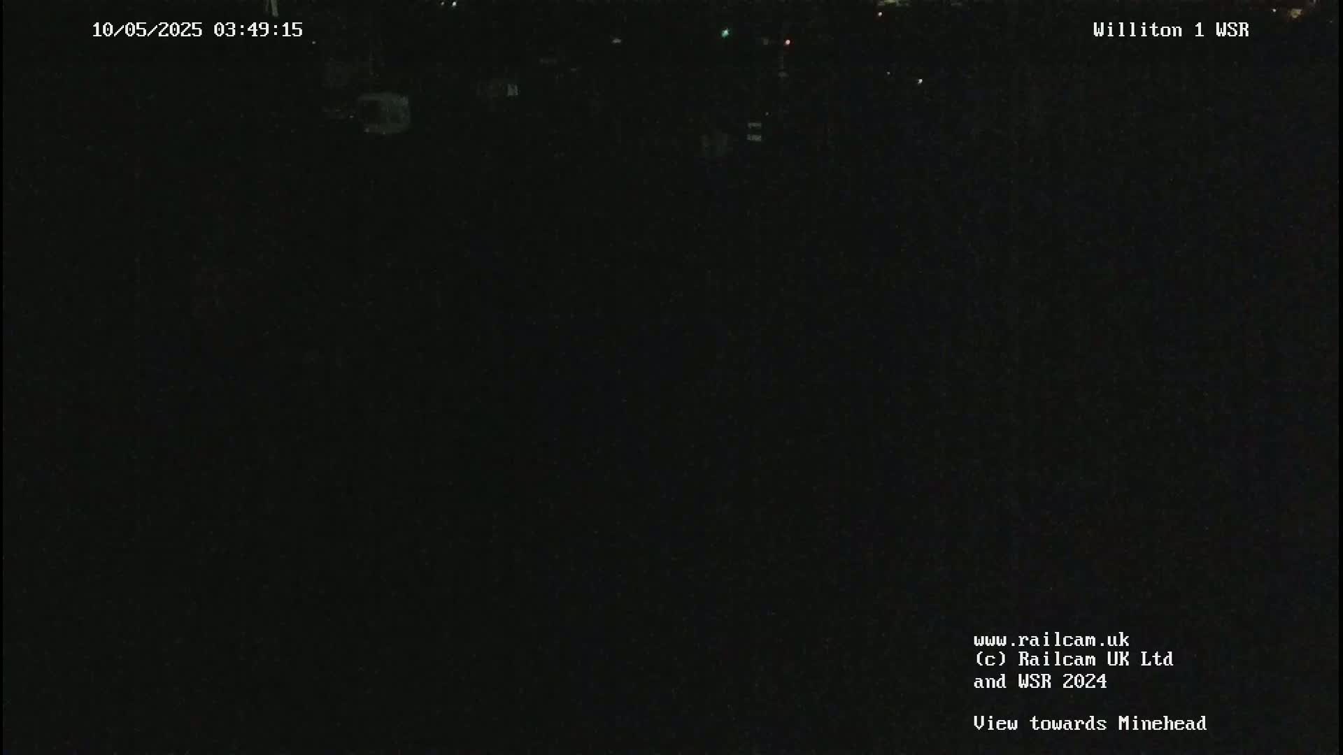A nighttime, dark view towards Minehead.