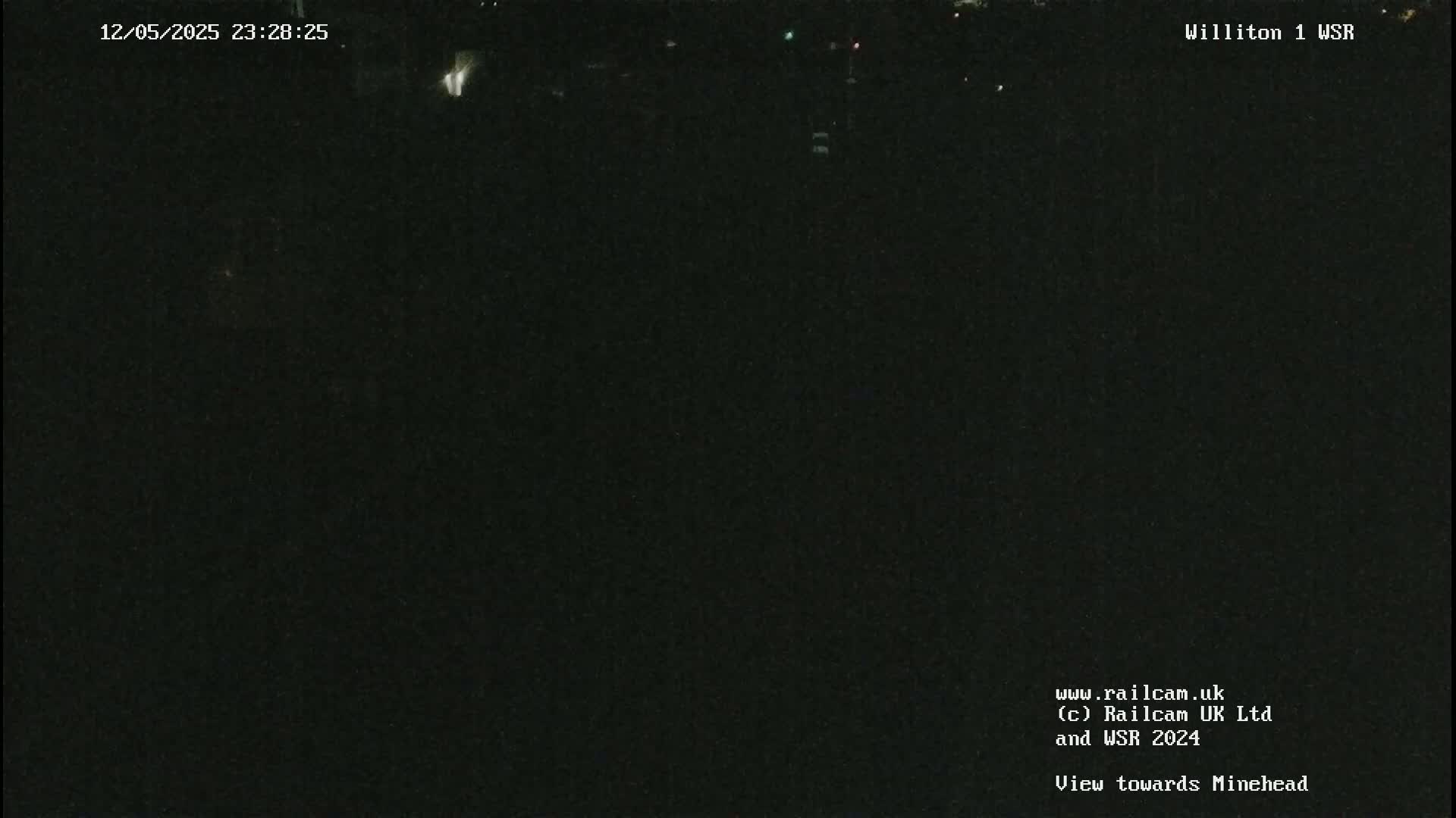 A nighttime view of a dark, mostly featureless scene.