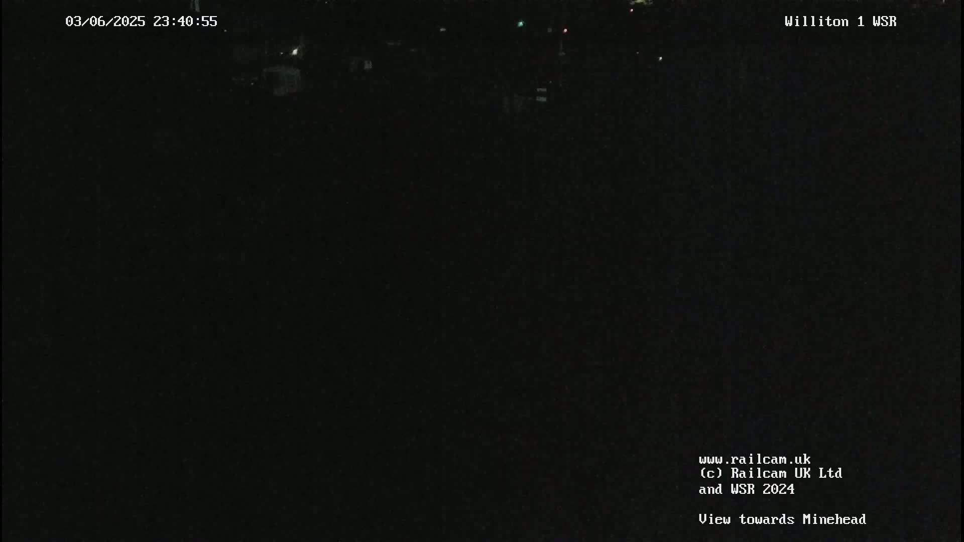 A nighttime, dark outdoor scene shows little to no visible detail.