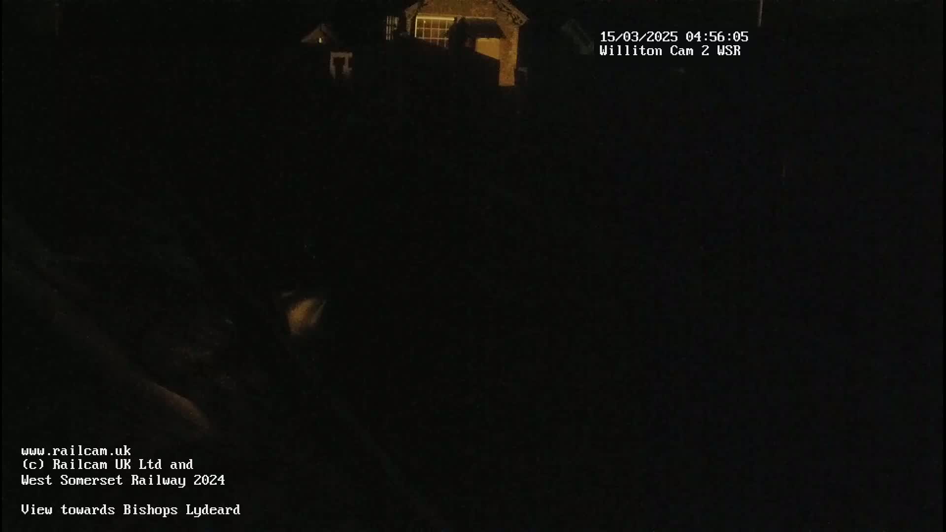 A nighttime, dark view of a building is shown.