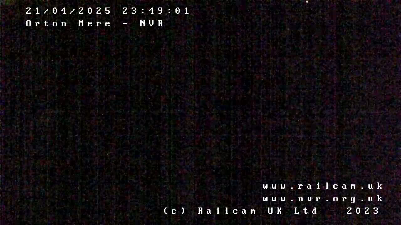 A completely dark image is shown, possibly an image from a night-vision camera.