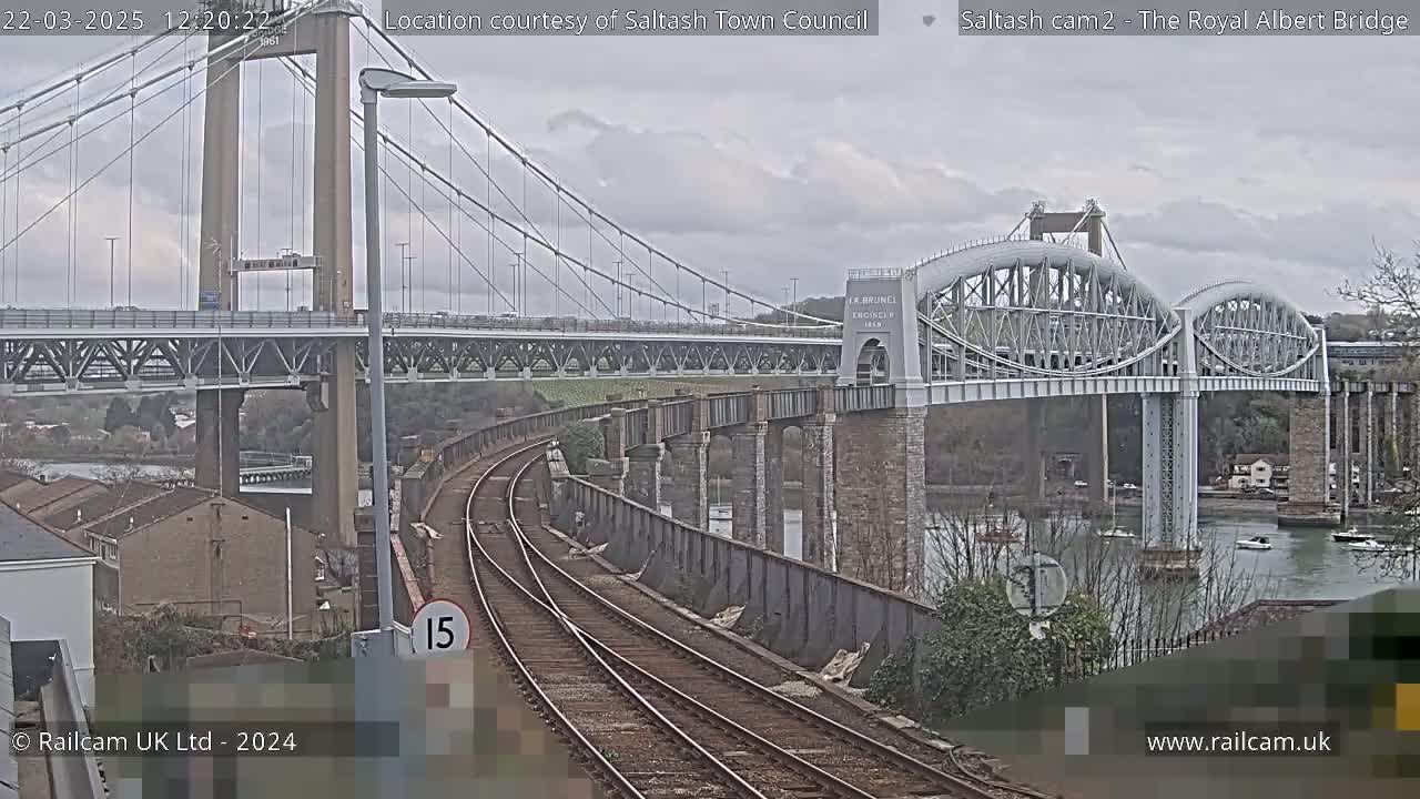 A view of two bridges and a railway track on an overcast day.