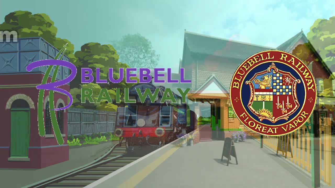A train is arriving at a railway station on a sunny day, with lush green trees and a water tower nearby.