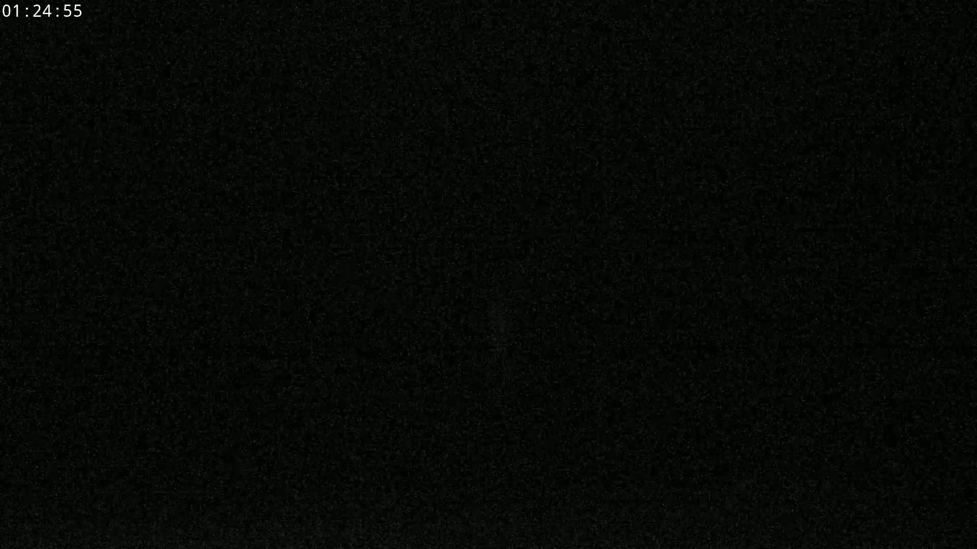 The image shows a completely black screen with a slightly grainy texture.