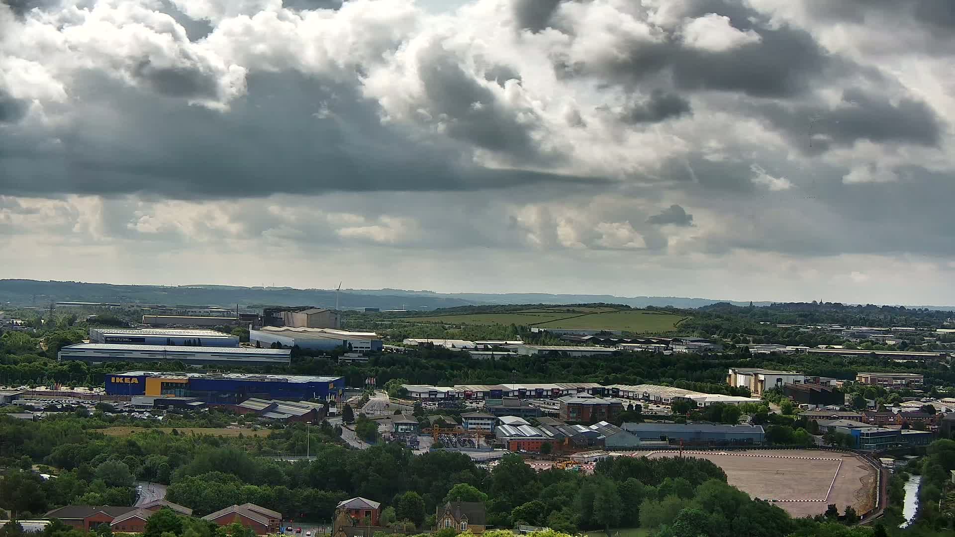A sprawling industrial area with an IKEA store is visible under a cloudy sky.