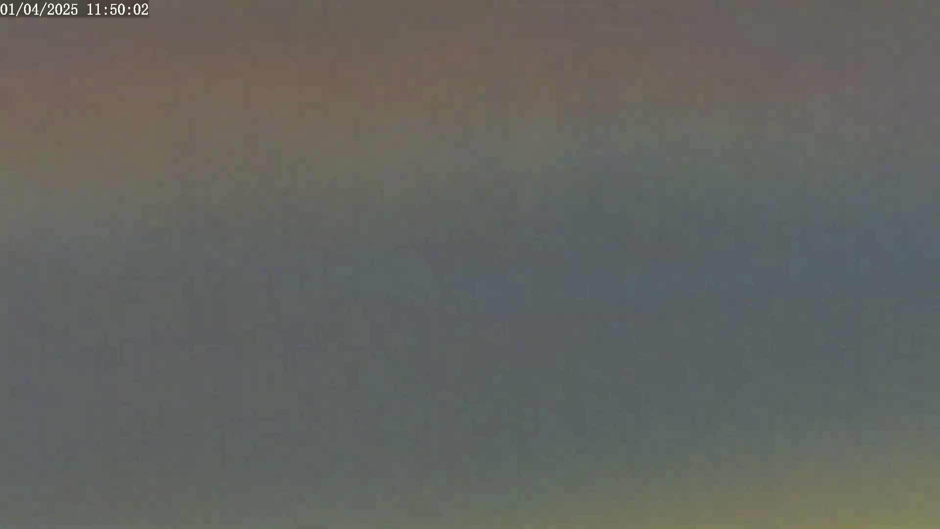 A hazy, overcast sky is visible.