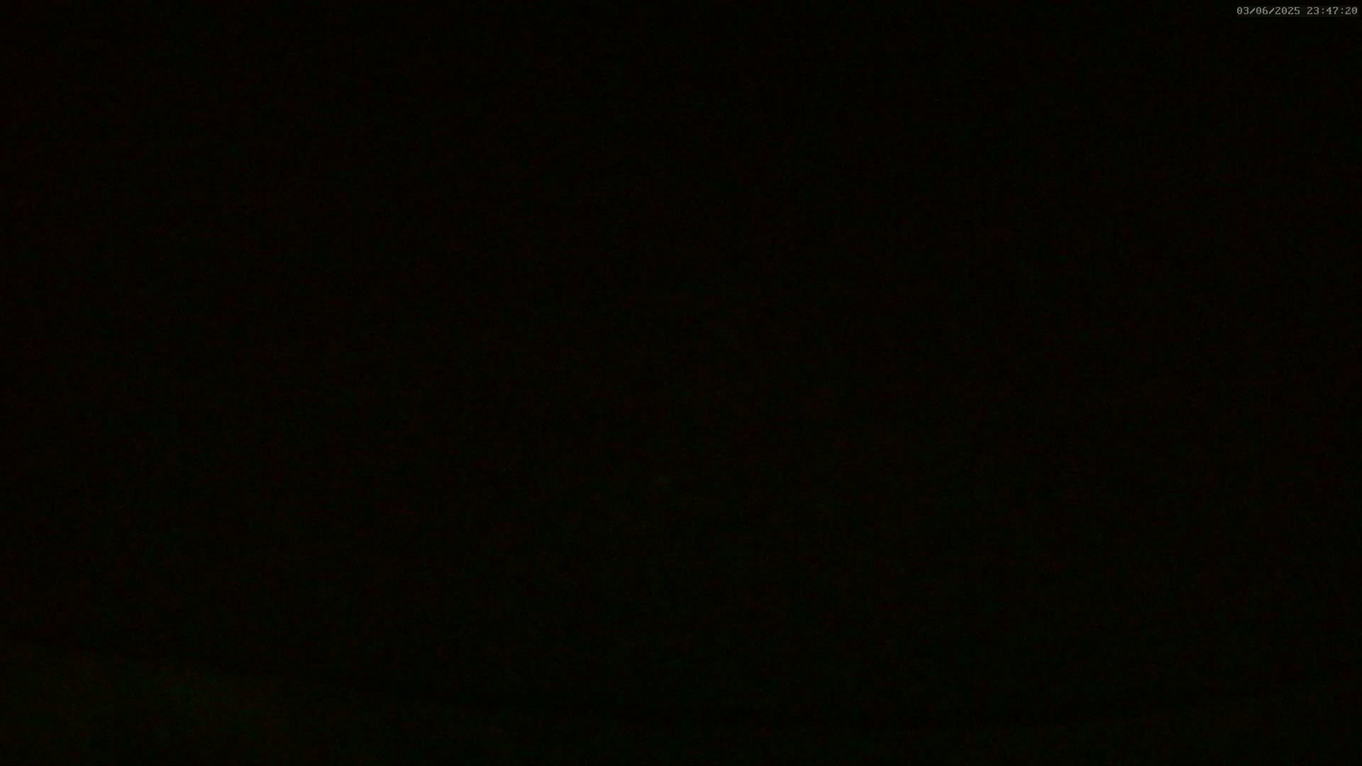 The image is completely black except for a very faint, indistinct suggestion of a lighter area at the very bottom.