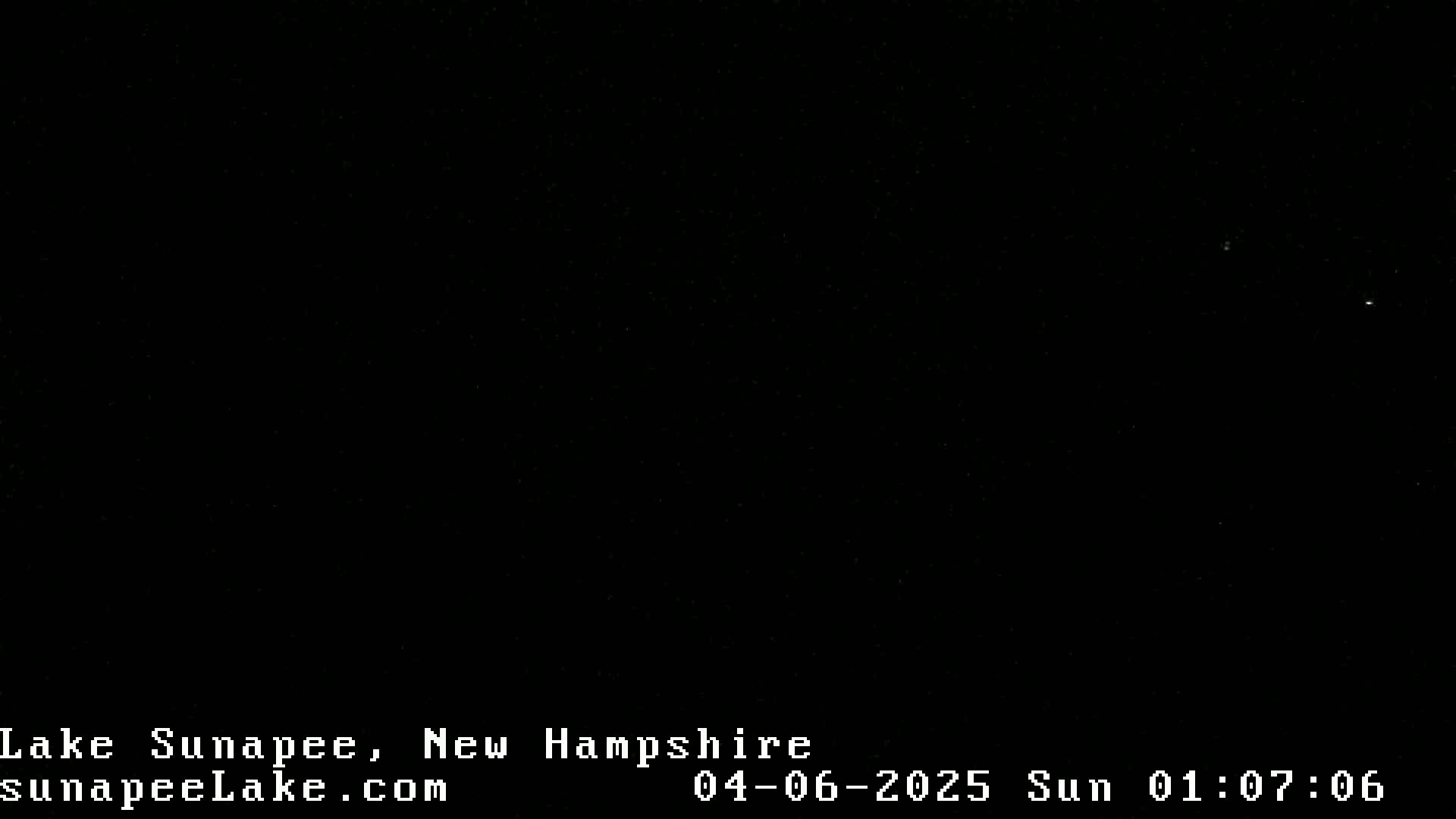 A nighttime image shows a completely dark sky with a few faint stars visible.