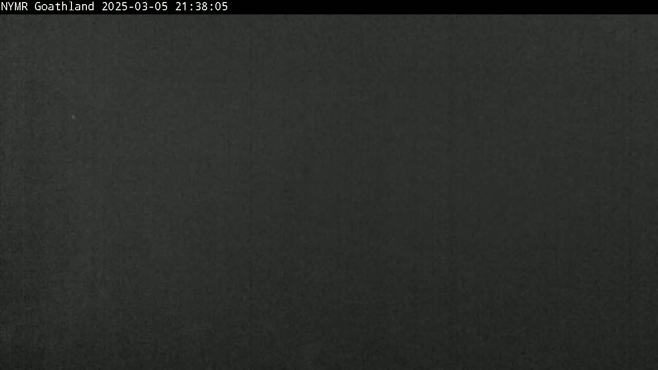 A dark, uniformly colored image shows a solid expanse of dark gray or black.