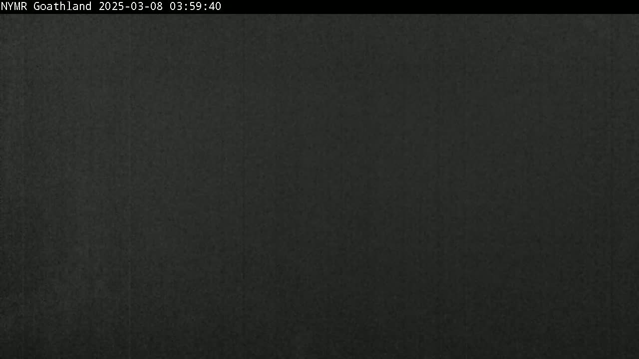 The image shows a uniformly dark gray or black surface.