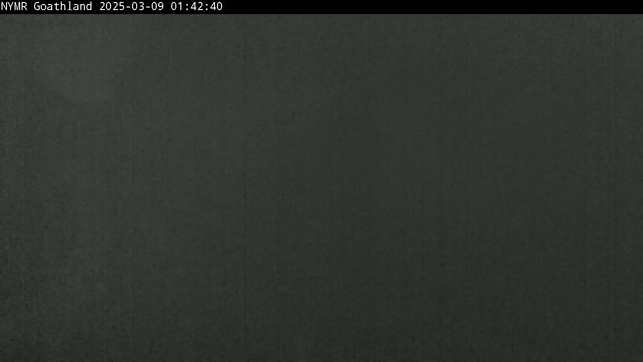 The image shows a uniformly dark gray or black surface.