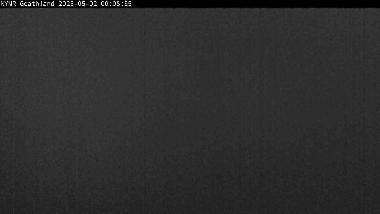 A dark, uniformly colored image shows a solid expanse of dark gray or black.