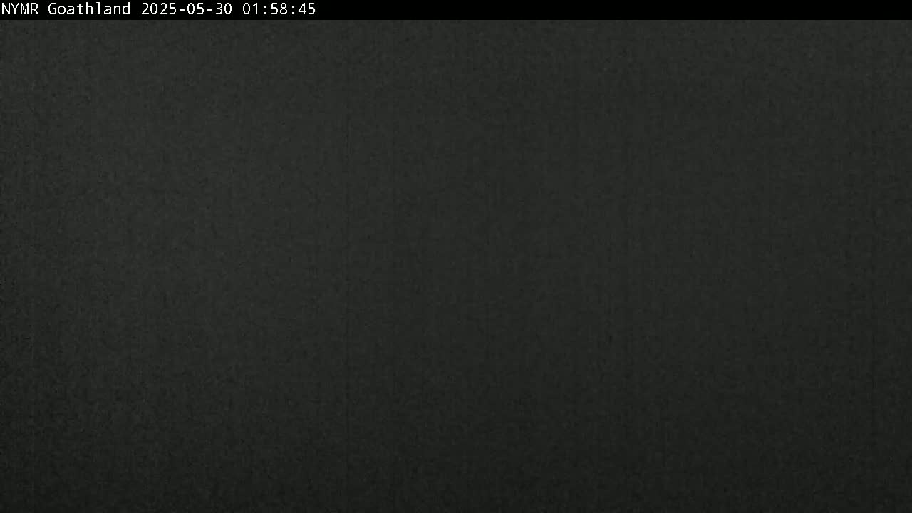 The image shows a solid dark-grey or black surface.