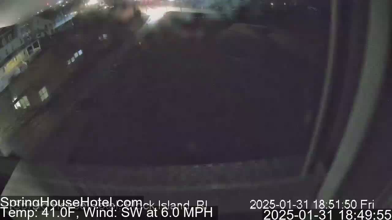 A nighttime, slightly blurry view of a residential area with a southwest wind at 6 mph and a temperature of 41°F.