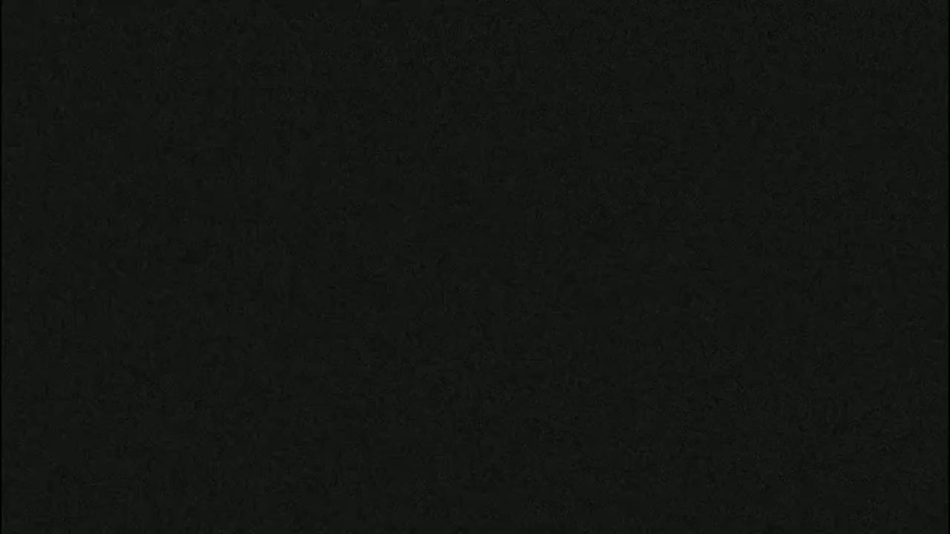 The image is a solid, dark-grey-black textured background.