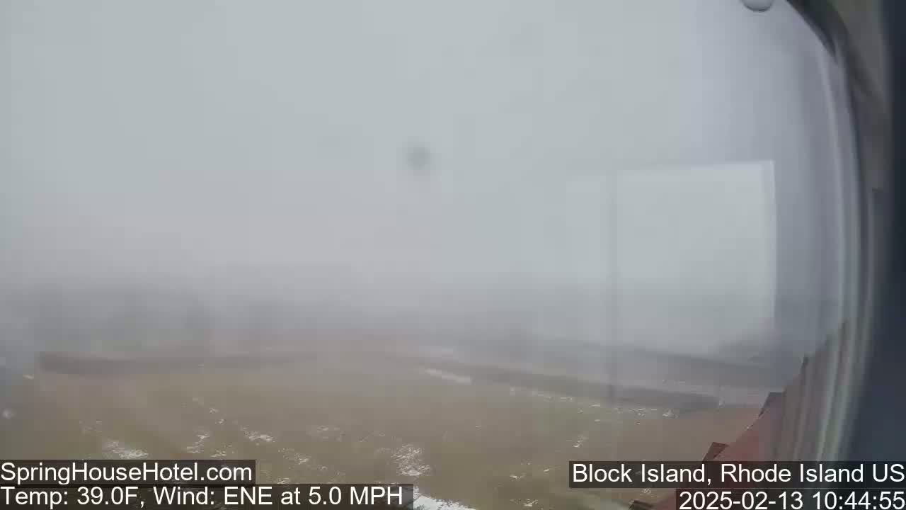 A hazy, snowy landscape is visible under overcast skies with a 5 mph wind from the east-northeast.