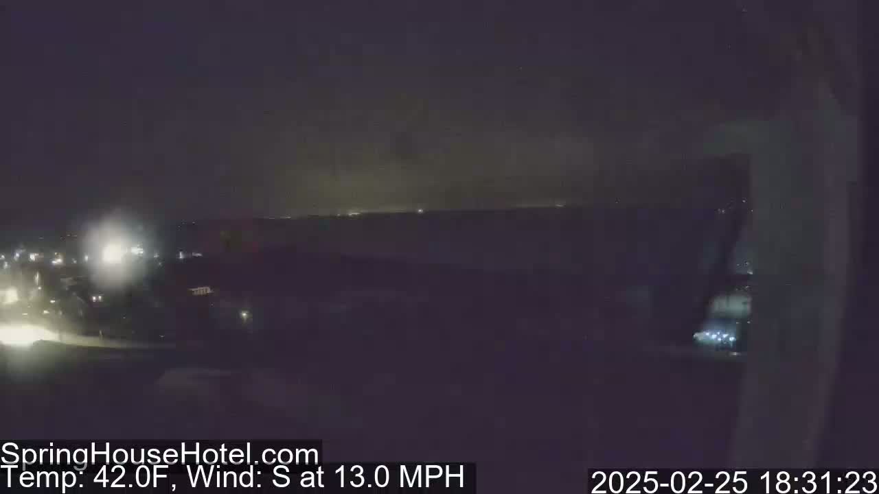 A nighttime view of a dimly lit landscape with a southern wind blowing at 13 mph and a temperature of 42°F.